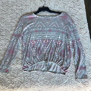 This is a cute kind of thin justice sweater. The size is a 14/16.